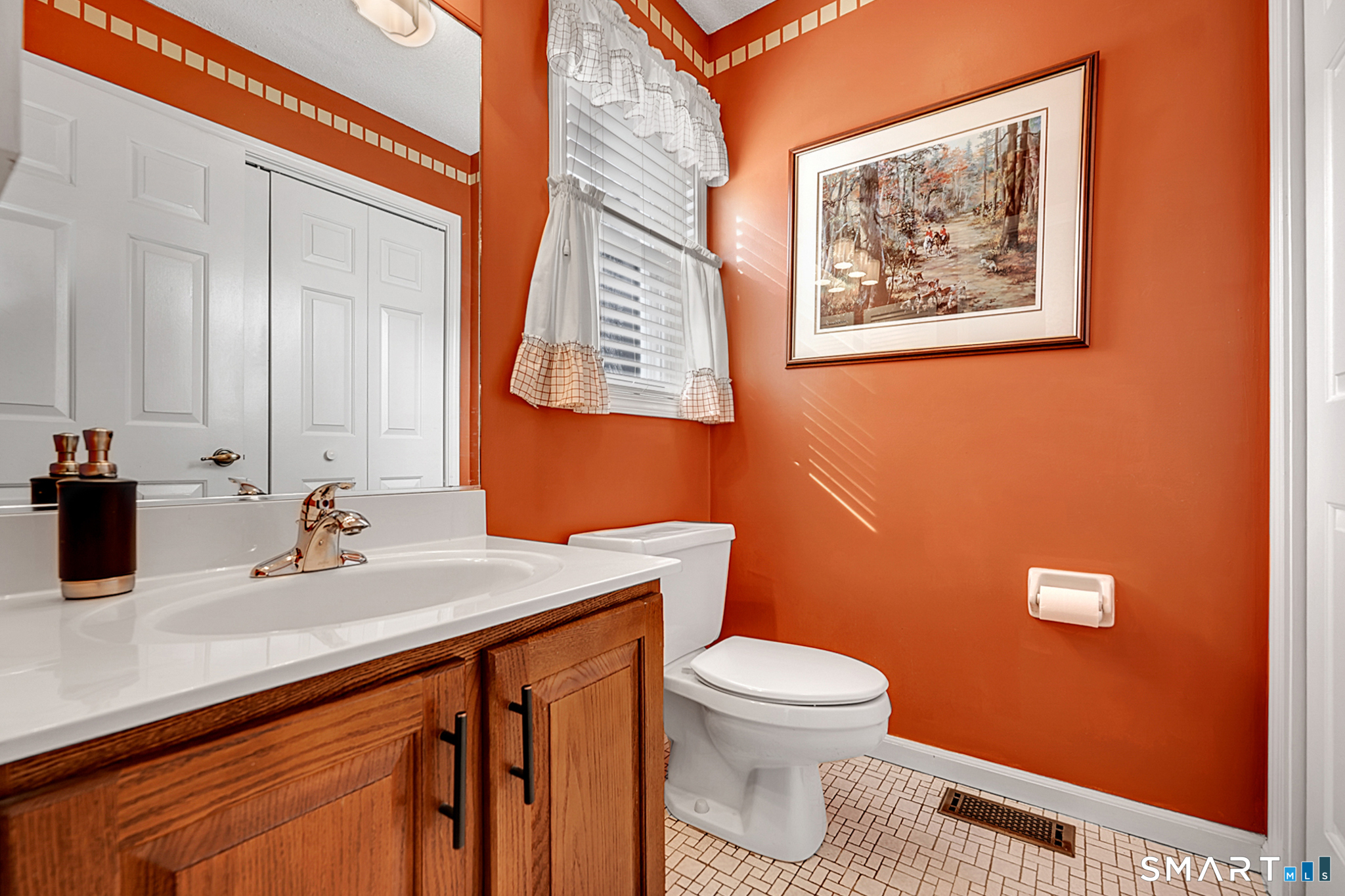 319 Thomaston Road, Unit 13 Watertown, CT 06795 - Photo 12 of 30 a bathroom with a toilet sink and mirror