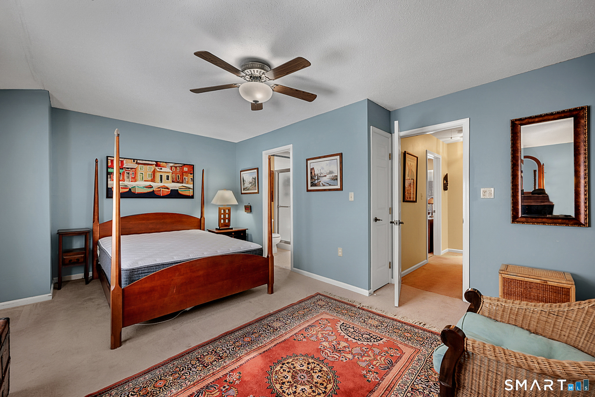 319 Thomaston Road, Unit 13 Watertown, CT 06795 - Photo 14 of 30 a bedroom with a bed and wooden floor