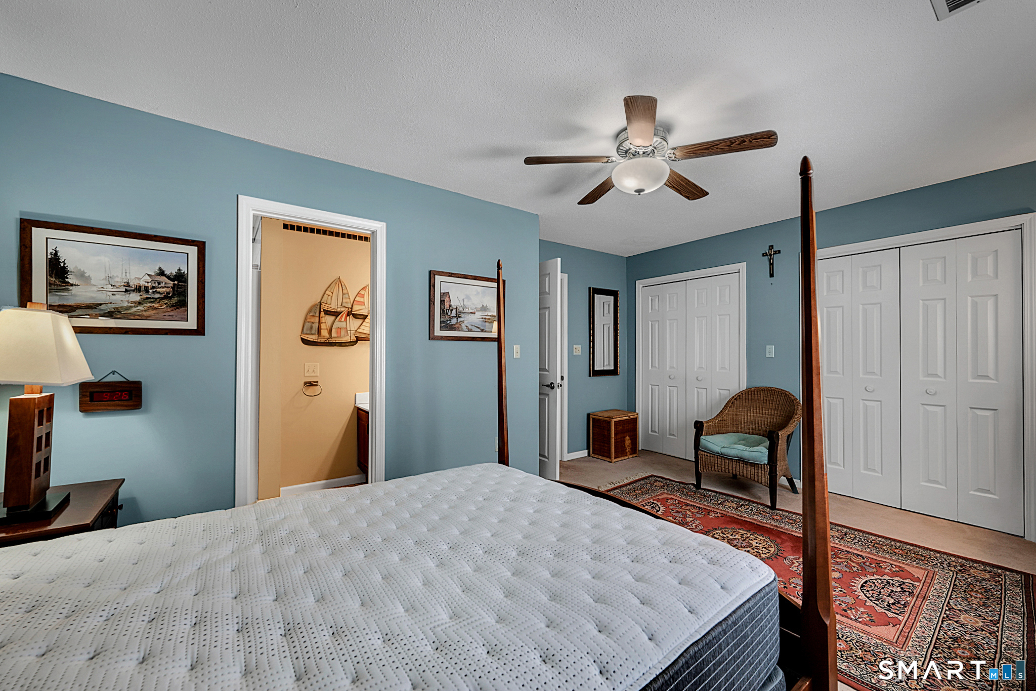 319 Thomaston Road, Unit 13 Watertown, CT 06795 - Photo 15 of 30 a bedroom with a bed and a chandelier