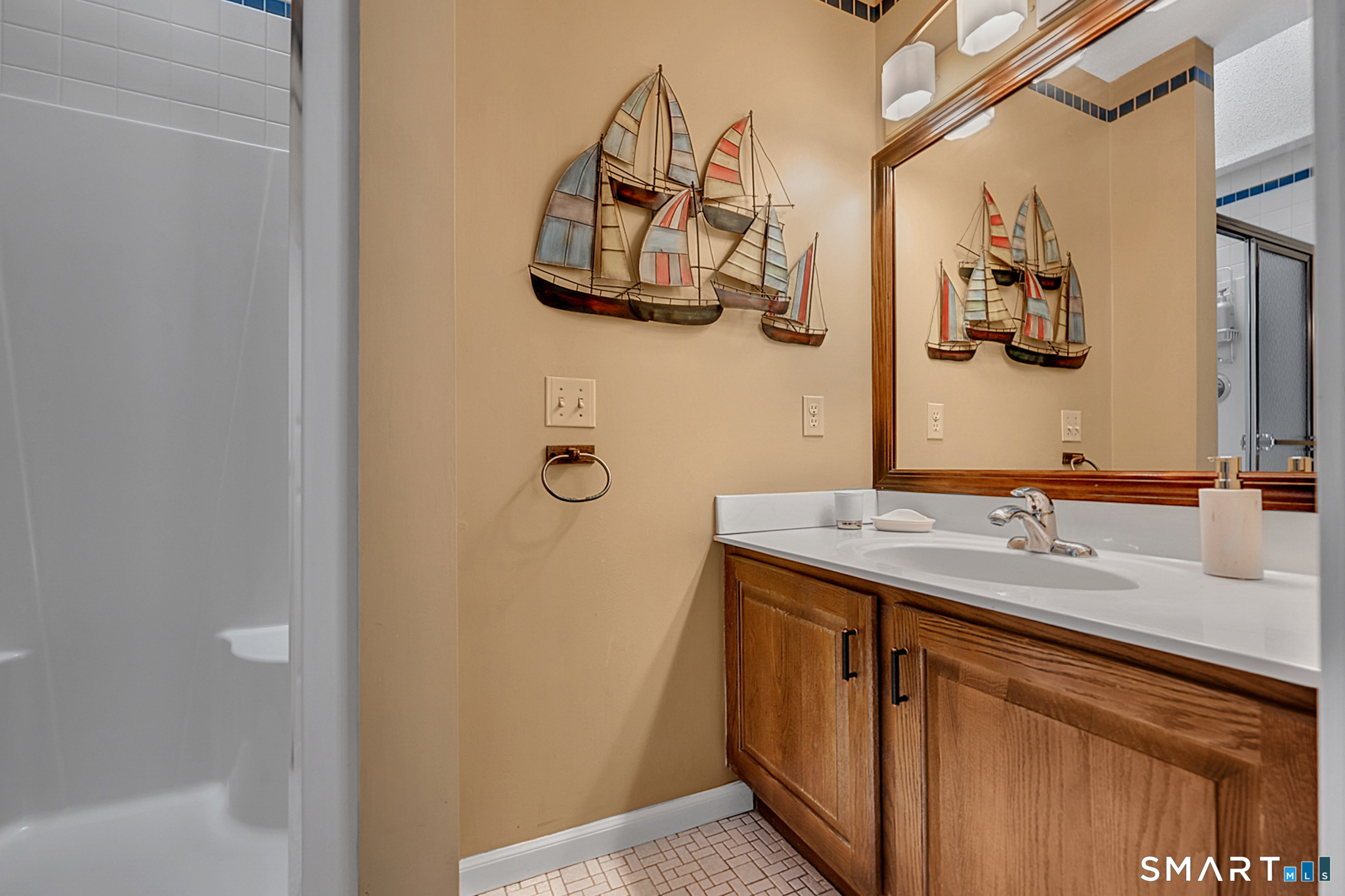 319 Thomaston Road, Unit 13 Watertown, CT 06795 - Photo 16 of 30 a bathroom with a granite countertop sink a mirror and shower