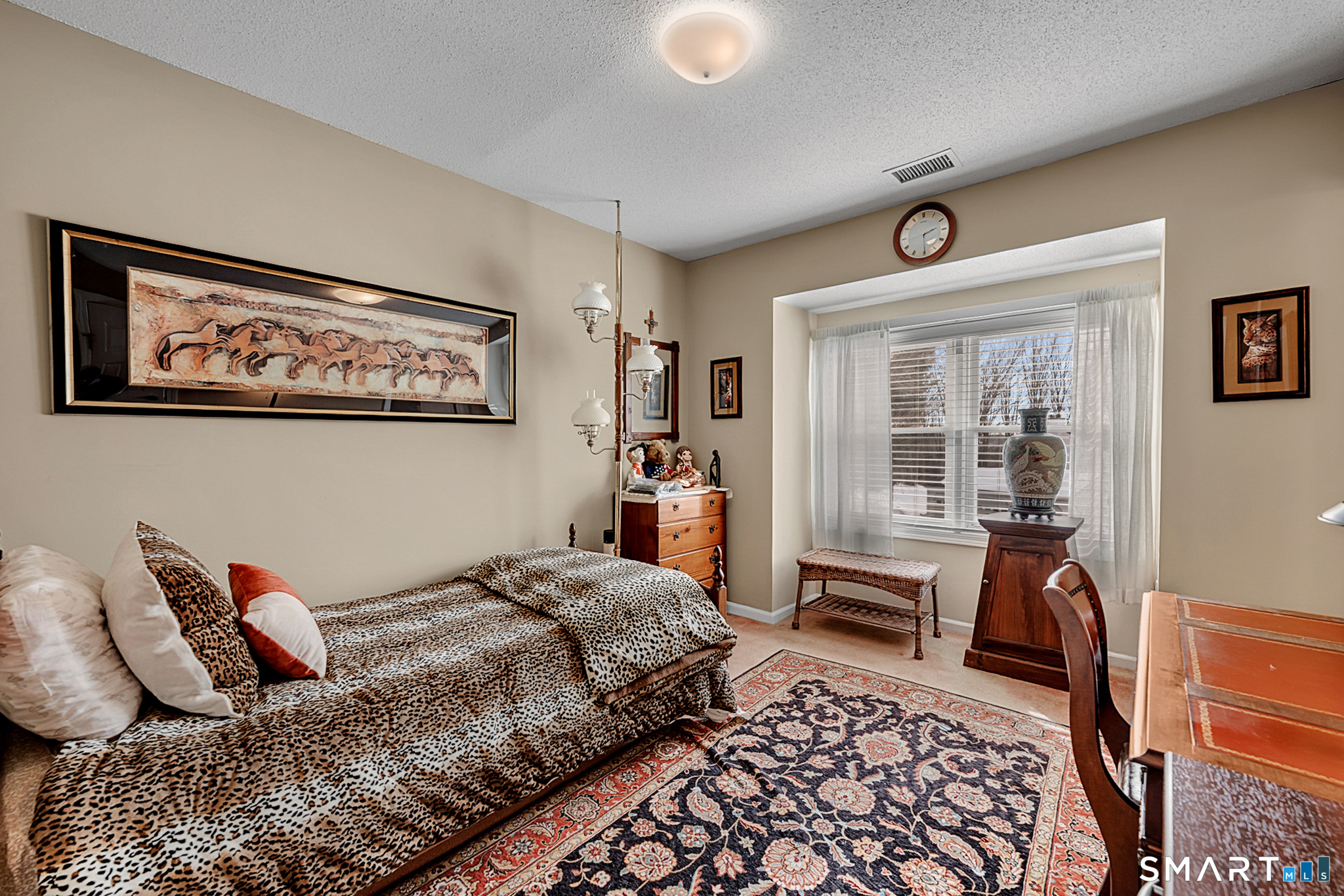 319 Thomaston Road, Unit 13 Watertown, CT 06795 - Photo 17 of 30 a bedroom with a bed and wooden floor