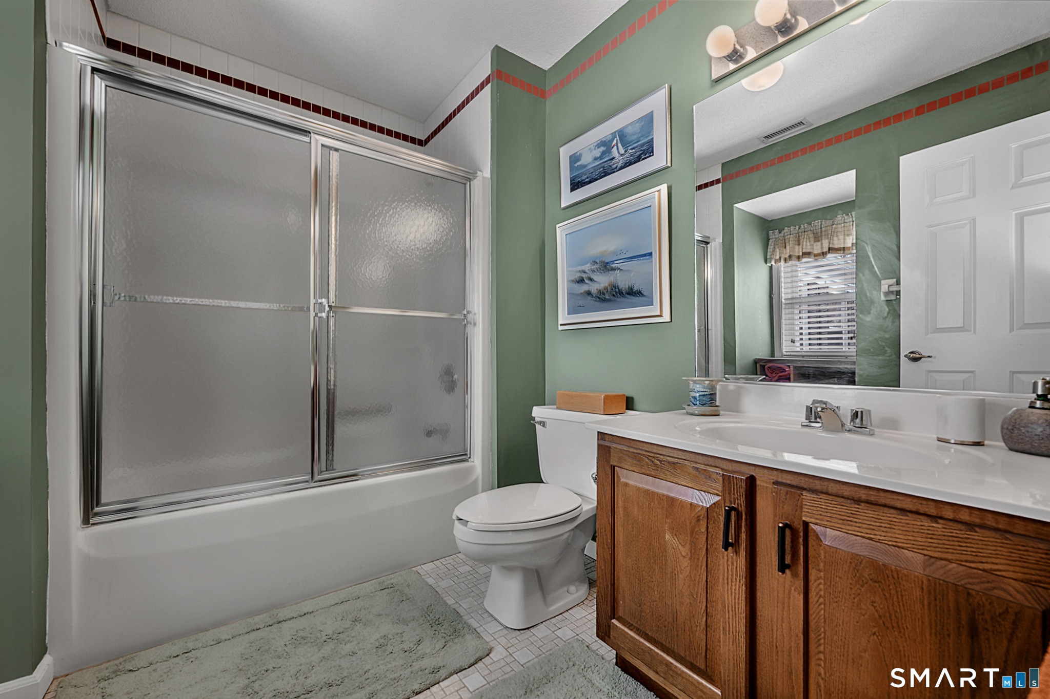 319 Thomaston Road, Unit 13 Watertown, CT 06795 - Photo 19 of 30 a bathroom with a sink a toilet and shower