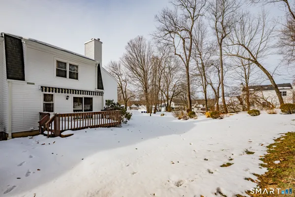 a view of a house with a snow in the yard