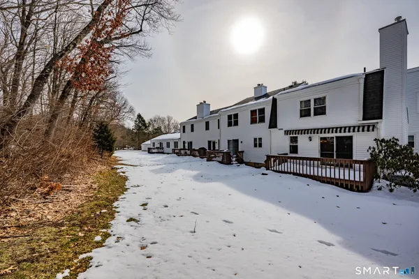 a view of a house with a snow in the background