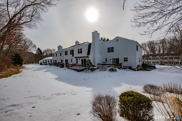 a view of a car park in front of house