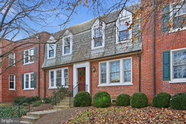 a view of a building next to a yard