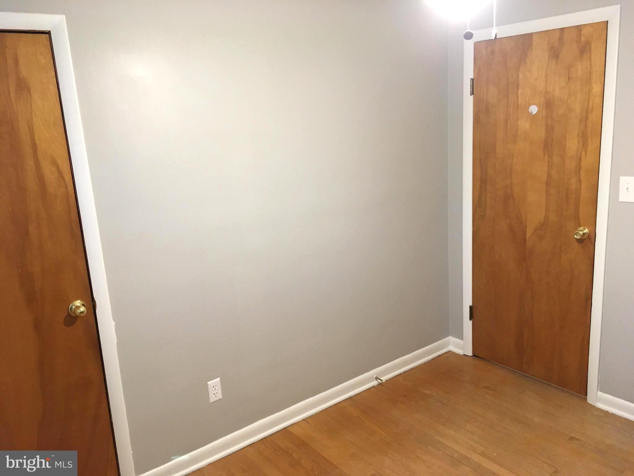 8103 Edwill Avenue Rosedale, MD 21237 - Photo 15 of 31 an empty room with wooden floor