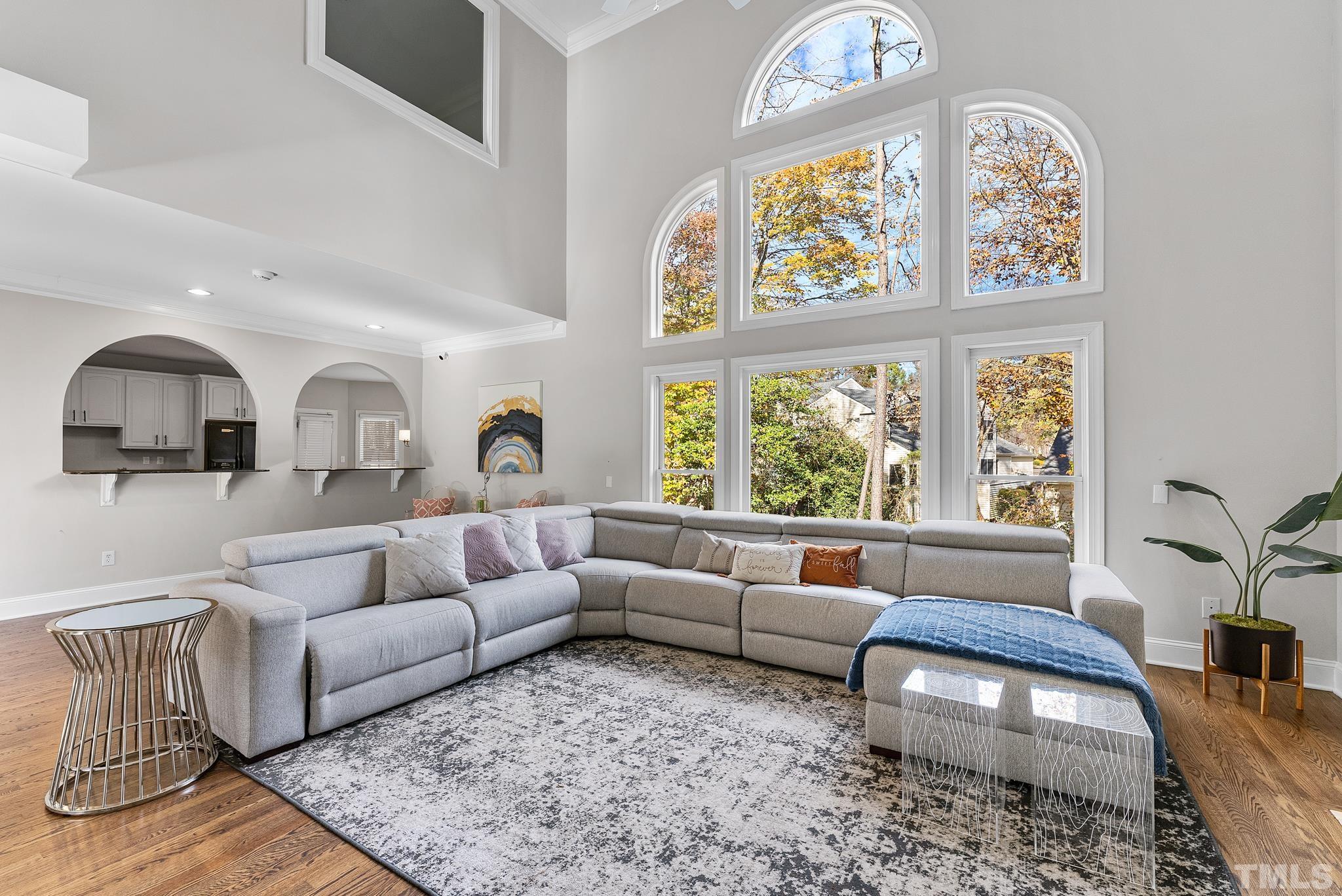 111 Redfern Drive Cary, NC 27518 - Photo 14 of 65 a living room with furniture and a large window