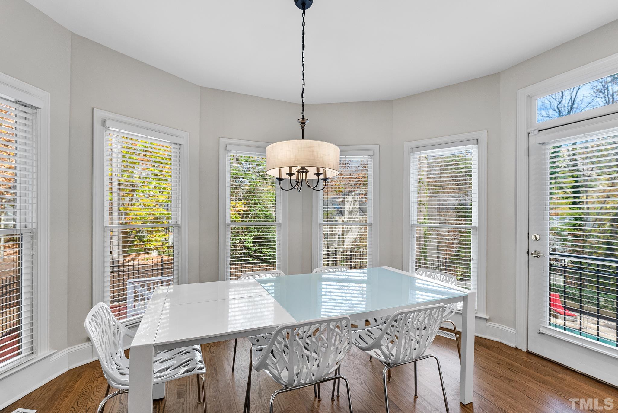 111 Redfern Drive Cary, NC 27518 - Photo 20 of 65 a view of a dining room with furniture window and wooden floor