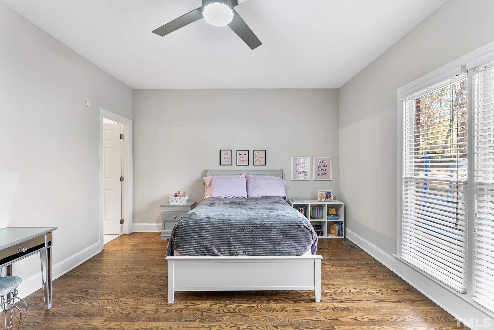 111 Redfern Drive Cary, NC 27518 - Photo 23 of 65 a living room with a bed furniture and a window