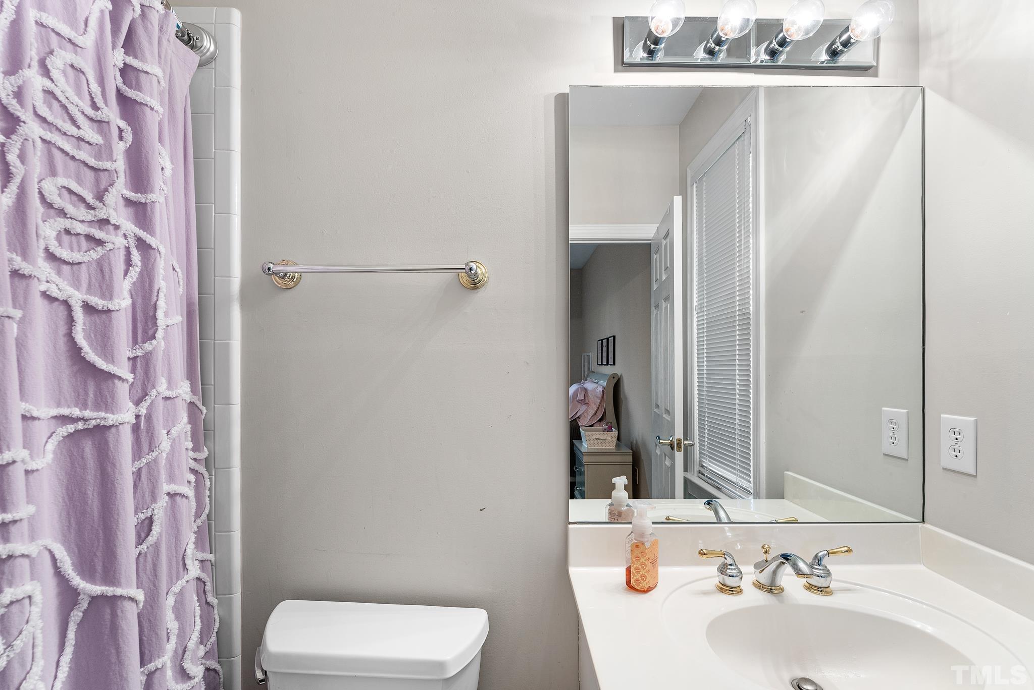 111 Redfern Drive Cary, NC 27518 - Photo 24 of 65 a bathroom with a sink and toilet