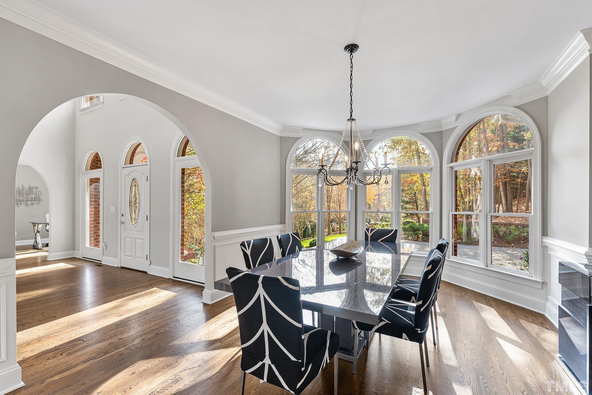 111 Redfern Drive Cary, NC 27518 - Photo 25 of 65 a view of a dining room with furniture window and wooden floor