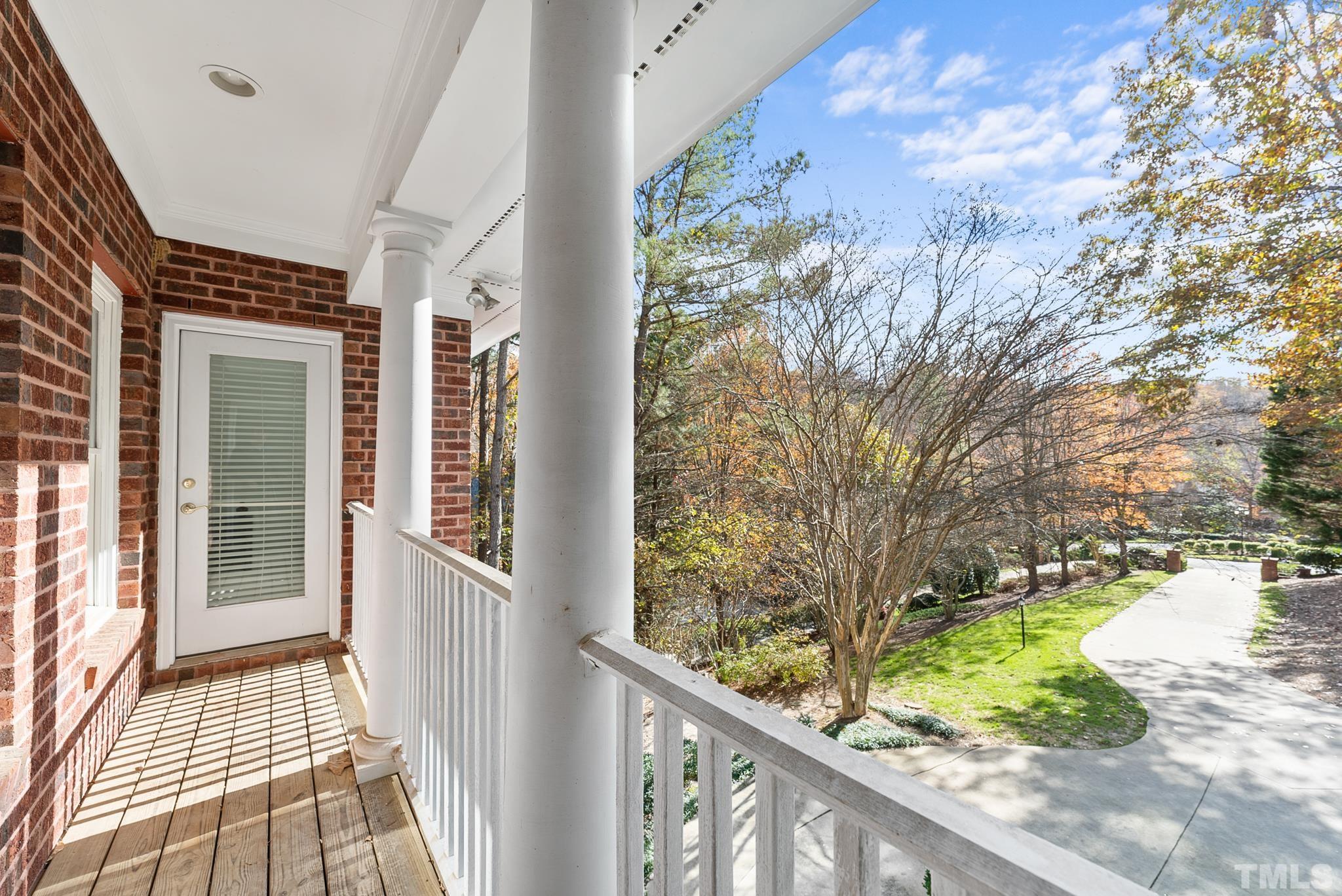111 Redfern Drive Cary, NC 27518 - Photo 34 of 65 a view of a balcony with wooden floor and fence