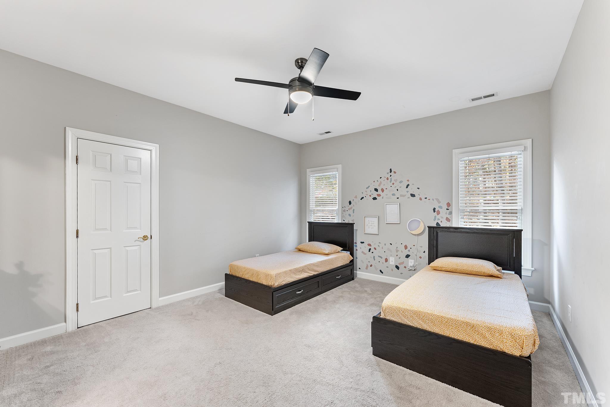 111 Redfern Drive Cary, NC 27518 - Photo 36 of 65 a bedroom with bed and window