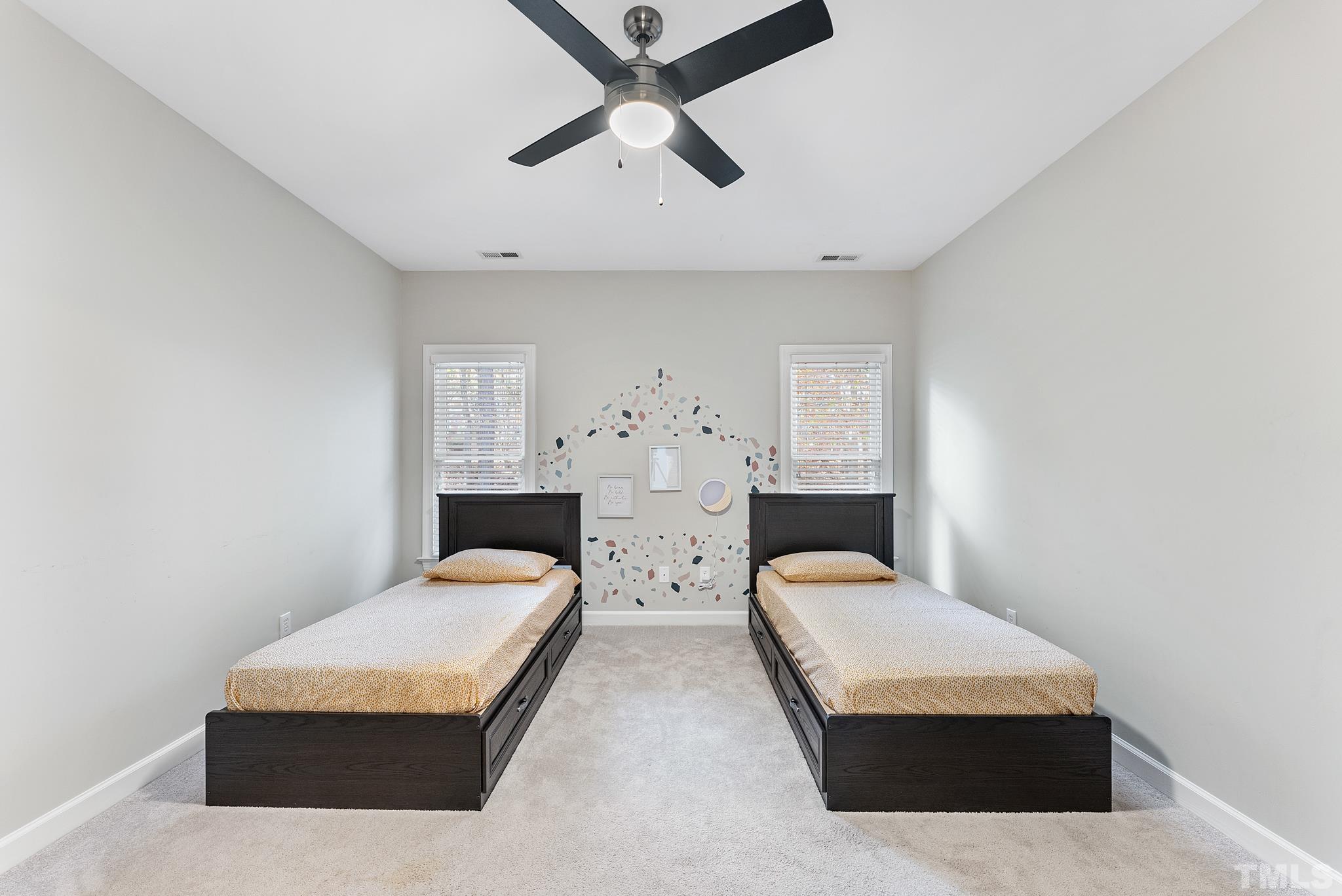 111 Redfern Drive Cary, NC 27518 - Photo 37 of 65 a bedroom with a bed and window