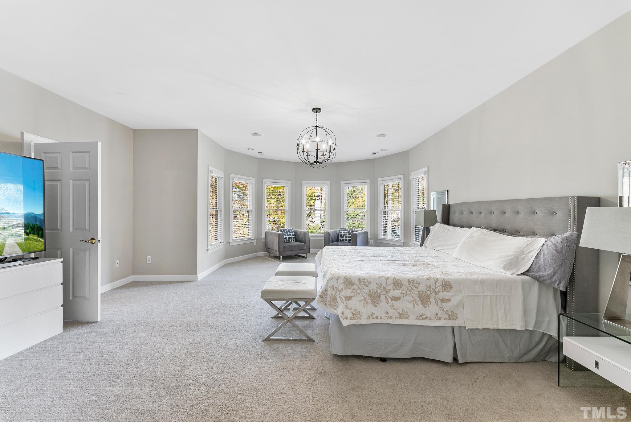 111 Redfern Drive Cary, NC 27518 - Photo 38 of 65 a bedroom with bed and window