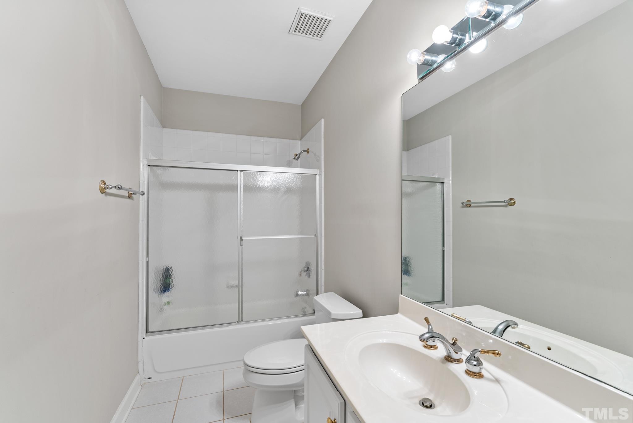 111 Redfern Drive Cary, NC 27518 - Photo 48 of 65 a bathroom with a sink toilet and shower