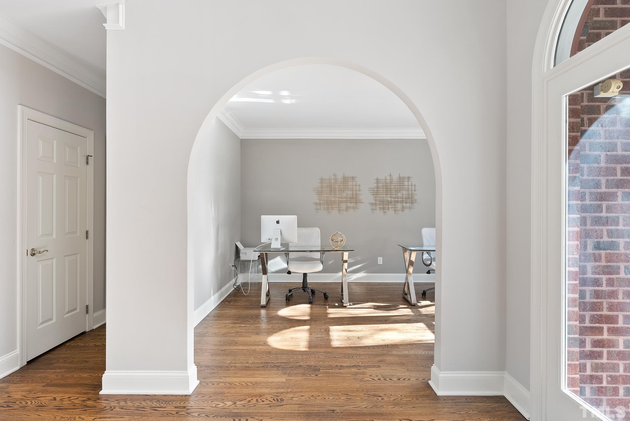 111 Redfern Drive Cary, NC 27518 - Photo 7 of 65 a living room with furniture and a fireplace