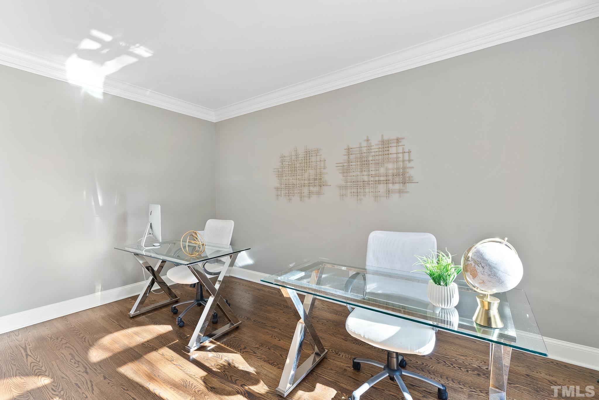 111 Redfern Drive Cary, NC 27518 - Photo 9 of 65 a workspace with furniture and a wooden floor