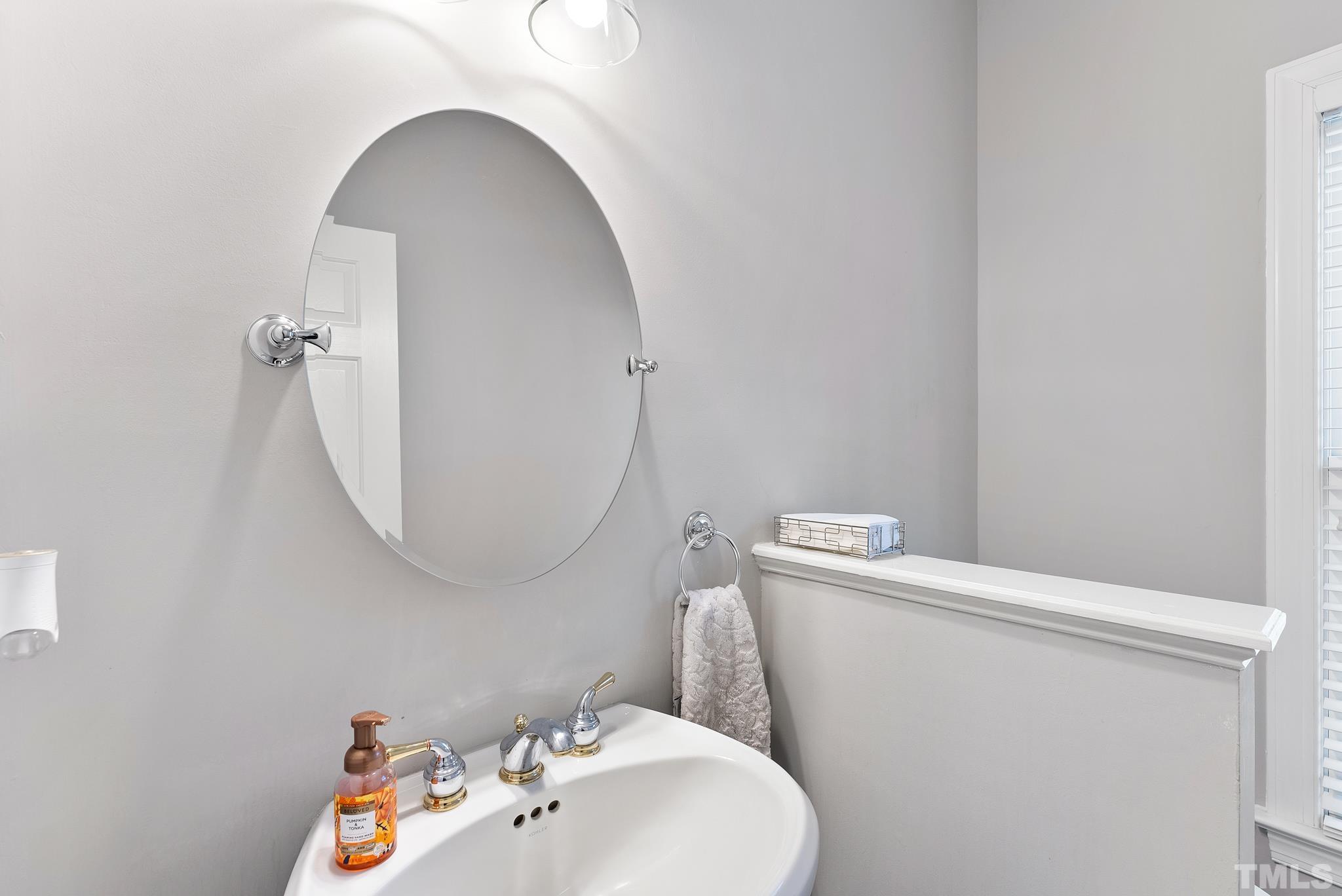 111 Redfern Drive Cary, NC 27518 - Photo 10 of 65 a bathroom with a sink mirror and toilet