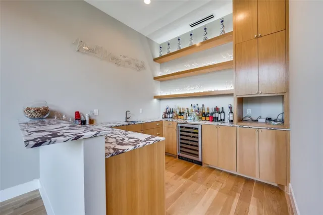 a kitchen with stainless steel appliances granite countertop a sink stove and white cabinets