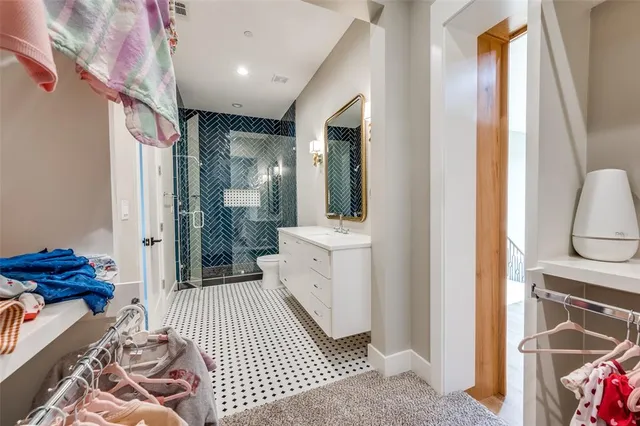 a bathroom with a sink a mirror and a shower