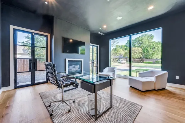 a living room with fireplace furniture and a flat screen tv