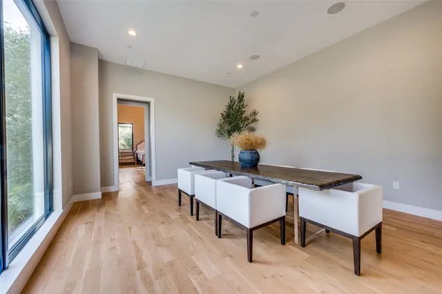 a view of work space with table chair and wooden floor