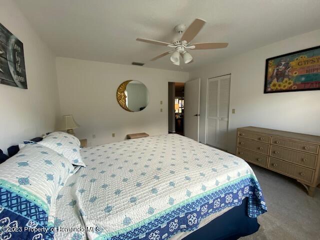 2671 Royal Ridge Drive Spring Hill, FL 34606 - Photo 16 of 34 a bedroom with a bed and cabinets