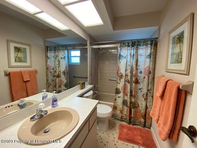 2671 Royal Ridge Drive Spring Hill, FL 34606 - Photo 18 of 34 a bathroom with a sink toilet and shower