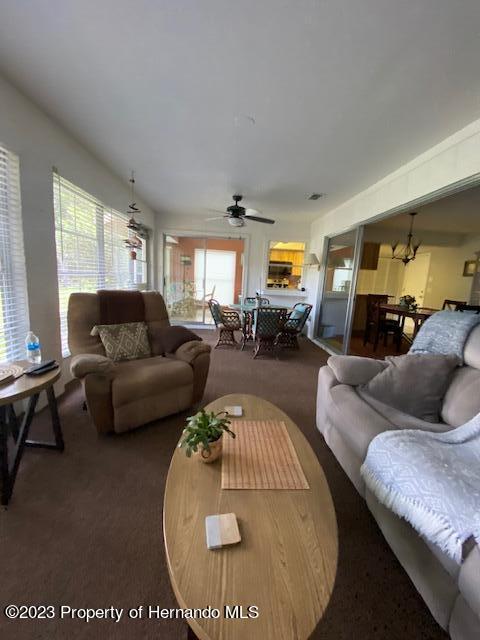 2671 Royal Ridge Drive Spring Hill, FL 34606 - Photo 26 of 34 a living room with furniture and a table
