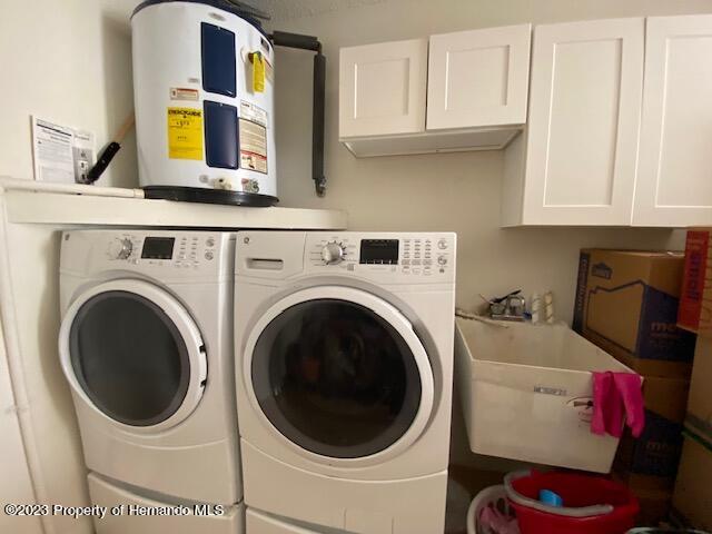 2671 Royal Ridge Drive Spring Hill, FL 34606 - Photo 28 of 34 a utility room with dryer and washer