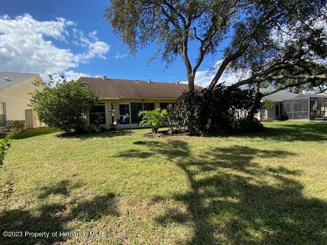 2671 Royal Ridge Drive Spring Hill, FL 34606 - Photo 33 of 34 a view of a house with a yard