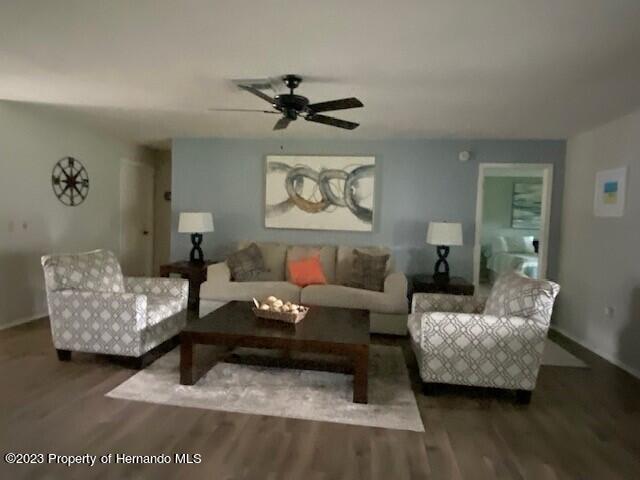 2671 Royal Ridge Drive Spring Hill, FL 34606 - Photo 6 of 34 a living room with furniture and a wooden floor