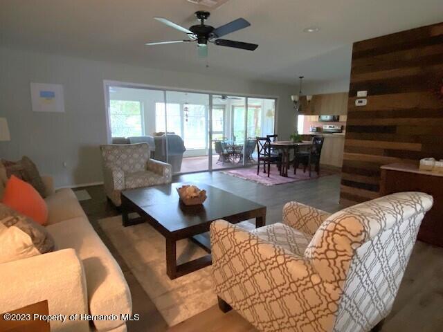 2671 Royal Ridge Drive Spring Hill, FL 34606 - Photo 7 of 34 a living room with furniture and a large window