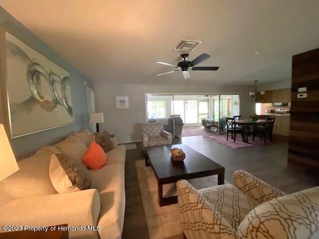 2671 Royal Ridge Drive Spring Hill, FL 34606 - Photo 8 of 34 a living room with furniture and kitchen view