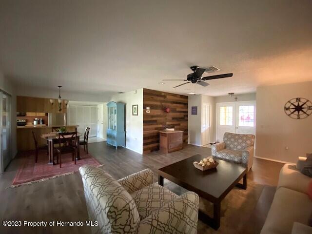 2671 Royal Ridge Drive Spring Hill, FL 34606 - Photo 9 of 34 a living room with furniture and a dining table