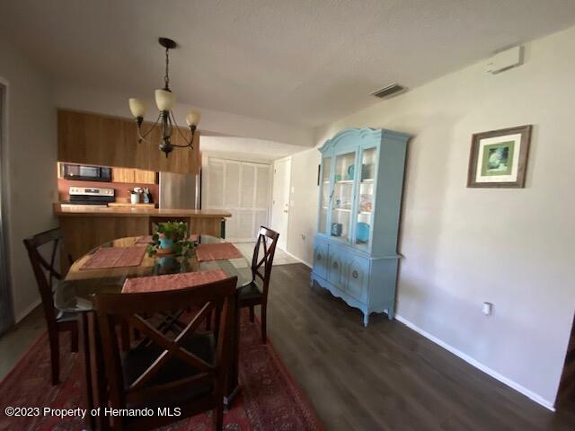2671 Royal Ridge Drive Spring Hill, FL 34606 - Photo 10 of 34 a view of a dining room with furniture