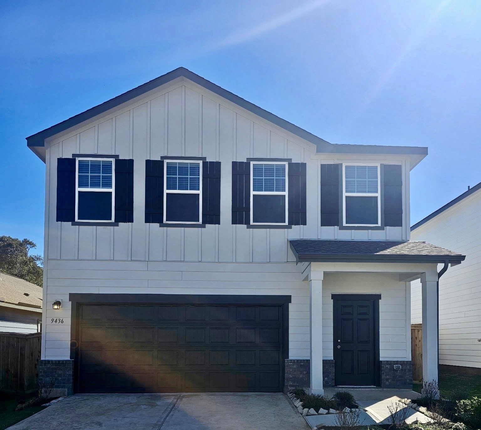 a front view of a house with a garage
