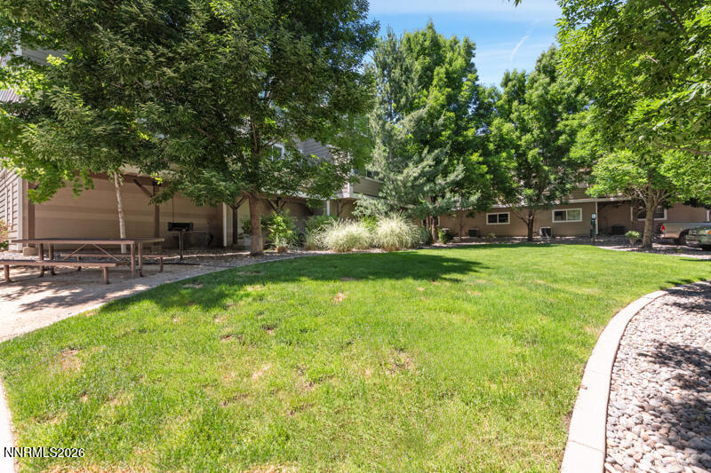 285 Mark Jeffrey Lane Reno, NV 89503 - Photo 20 of 20 a swimming pool with outdoor seating and yard