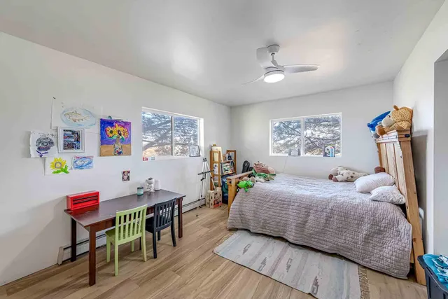 a bedroom with a bed and a table in it