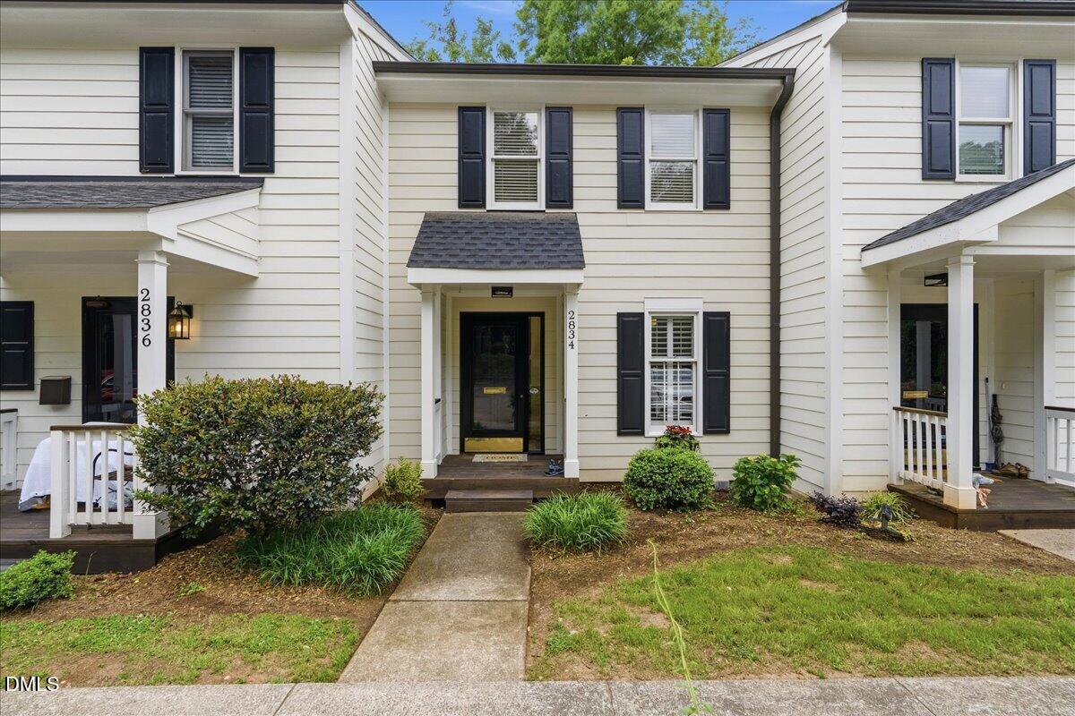 2834 Wayland Drive Raleigh, NC 27608 - Photo 24 of 26 a front view of a house with garden