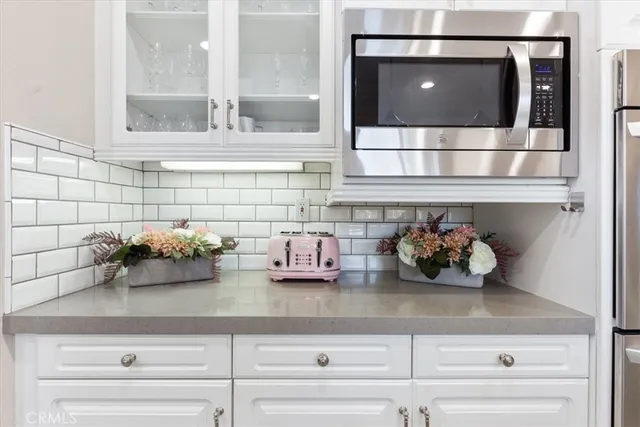 a kitchen with a stove and cabinets
