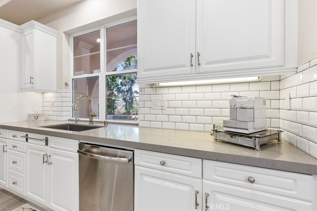33 Craftsbury Place Ladera Ranch, CA 92694 - Photo 15 of 33 a kitchen with sink and cabinets