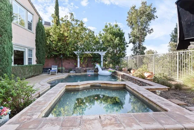a view of swimming pool from a lounge chair