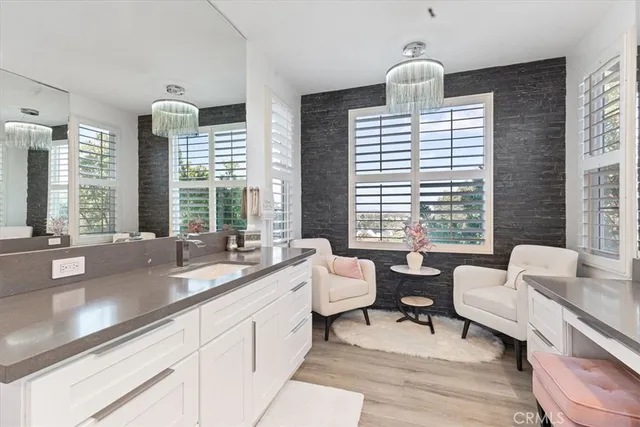 a reception area with double vanity and windows