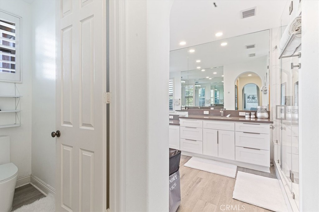 33 Craftsbury Place Ladera Ranch, CA 92694 - Photo 24 of 33 a bathroom with a toilet sink and mirror