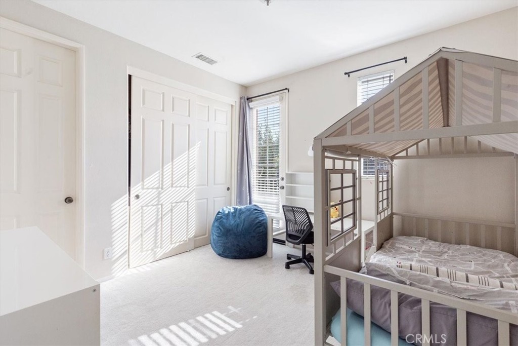 33 Craftsbury Place Ladera Ranch, CA 92694 - Photo 25 of 33 a bedroom with furniture and a window