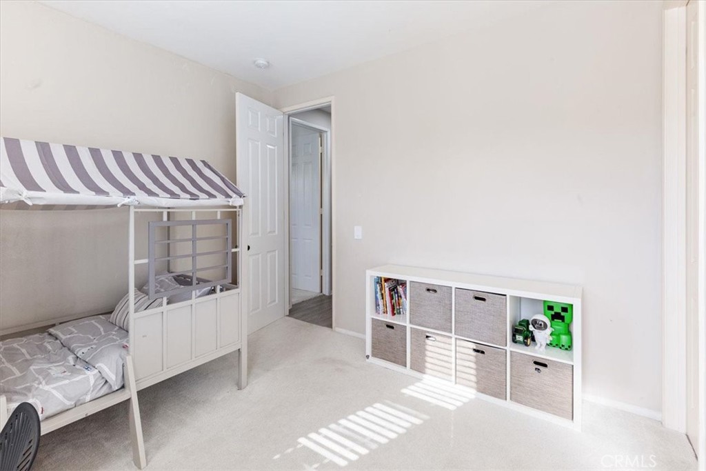 33 Craftsbury Place Ladera Ranch, CA 92694 - Photo 26 of 33 a bedroom with furniture and a window