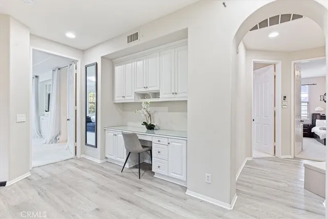 a view of kitchen with furniture and wooden floor